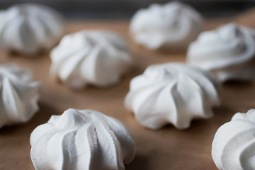 Meringues on a white plate. Dessert Pavlova.