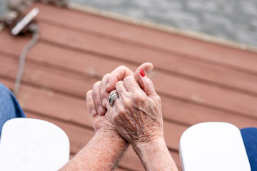 A senior couple holding hands while on vacation. Beautiful couple in their seventies celebrating a long, happy marriage.