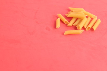 pasta raw feathers on colorful background