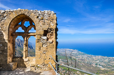 Medieval ruins of the St. Hilarion Castle offering an amazing view over the landscape of Cypriot Kyrenia region and Mediterranean. The window of the castle is a popular view point