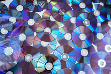 Bunch of cd discs on a white background