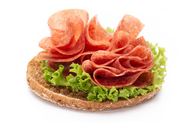 Sandwich with ham sausage on white background.