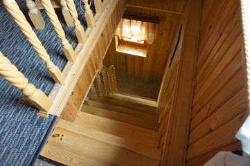 Fototapeta na wymiar Wooden staircase in a country house.