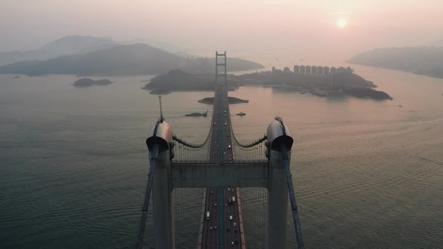 Aerial drone scene fly over Tsing Ma bridge in Hong Kong, near Tsing Yi area, 4k videos in sunset time