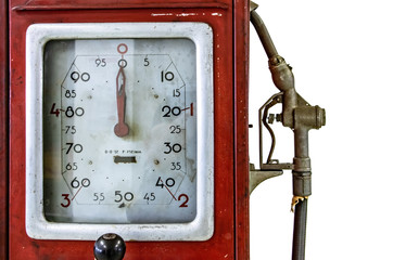 The retro analog petrol pump dial face with nozzle. A vintage red gas oil pump isolated in white...