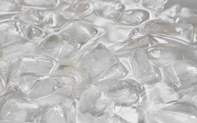 ice cube floating on water in plastic tray