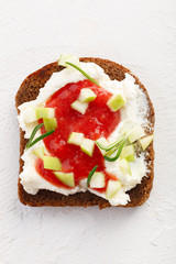 healthy breakfast. Bruschetta with cheese, strawberry jam and apples on white background
