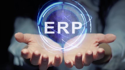 Female hands show a round conceptual hologram with text ERP. Unrecognizable woman in ashen white on a black background with future holographic technology