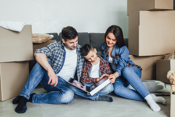 Moving! Son looking at photo album with mother and father wedding! Lifestyle!