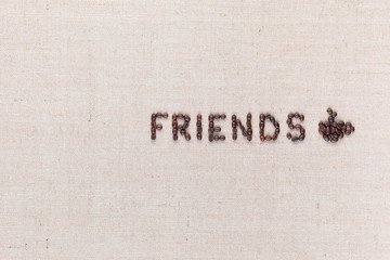 The word friends next to a coffee mug both made from coffee beans,aligned to the right.