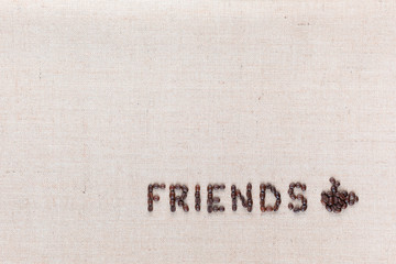 The word friends next to a coffee mug both made from coffee beans,aligned at the bottom left.