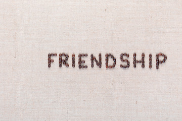 Friendship word written with coffee beans, aligned to the right.