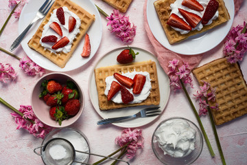 Fototapeta na wymiar Fluffy Waffle with strawberries. Homemade belgian waffle.