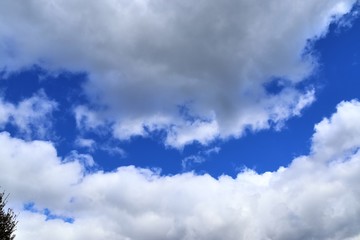 Beautiful white cloud formations in a deep blue sky on a sunny day