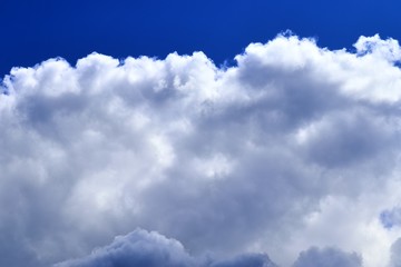 Beautiful white cloud formations in a deep blue sky on a sunny day