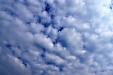 Beautiful white cloud formations in a deep blue sky on a sunny day