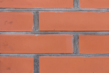 The brick texture, wall, with cracks and scratches can be used as a background