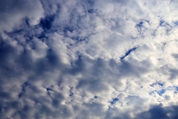 Beautiful white cloud formations in a deep blue sky on a sunny day