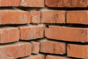 Fototapeta premium The brick texture, wall, with cracks and scratches can be used as a background