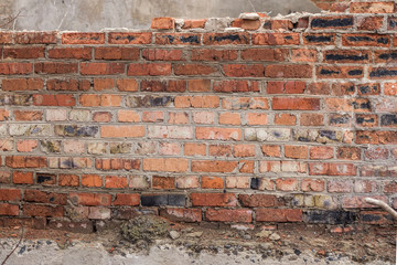 The brick texture, wall, with cracks and scratches can be used as a background
