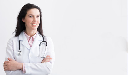 Portrait Of Successful Doctor Posing On Light Background