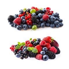 Berries isolated on white background. Ripe blueberries, blackberries, blackcurrants, raspberries, gooseberries and red currants. Mix fruits on white background. Mix berries with copy space for text. 