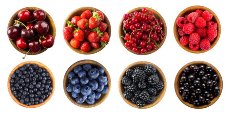 Berries and fruits isolated on white background. Raspberries, strawberries, currants, cherries, blueberries, bilberries and blackberries. Top view. 