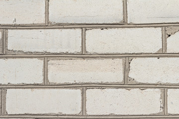 The brick texture, wall, with cracks and scratches can be used as a background