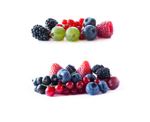 Ripe blueberries, blackberries, blackcurrants, strawberries, raspberries, gooseberries and red currants. Mix fruits on white background. Mix berries with copy space for text.