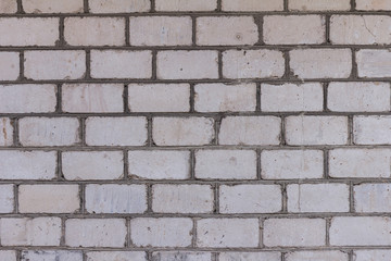 The brick texture, wall, with cracks and scratches can be used as a background