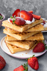 Homemade belgian Waffle. Strawberies and whiped cream.
