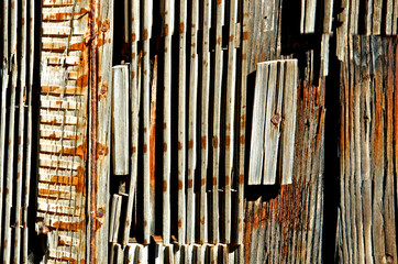 Weathered Wood Abstract. Old miners cabin with “found material” used as building material,...