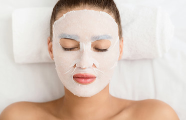Beauty Treatment Concept. Woman With Facial Sheet Mask