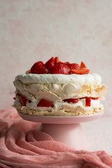 Pavlova cake topped with strawberries.