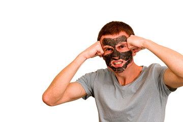 Guy in a cosmetic black face mask