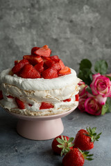 Fototapeta na wymiar Cake with strawberries. Dark background.