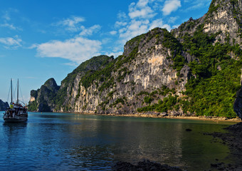 Fototapeta na wymiar Vietnam, Ha Long Bay Vietnamese cruise junk sails in sea landscape travel