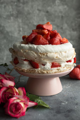 Pavlova cake topped with strawberries.