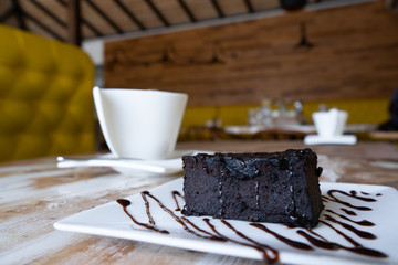Chocolate brownie cake and coffee mug