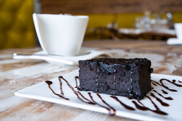 Chocolate brownie cake and coffee mug