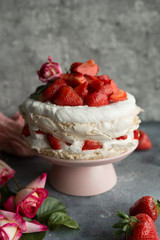 Cake with strawberries. Dark background.