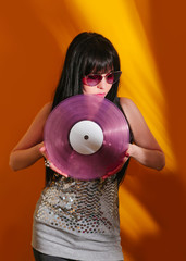 dj disco girl party retro vintage yellow orange young woman vinyl glamour light sun sunlight set...
