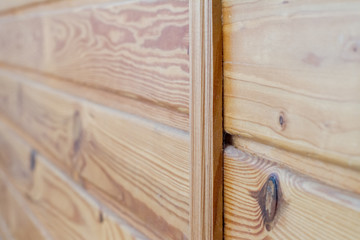 Closeup of wooden boards fastened by a cross bar, the theme of environmental friendliness.