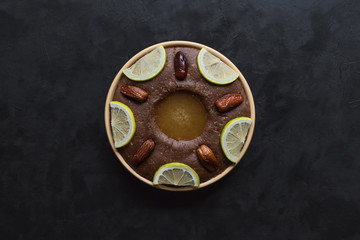 Saudi Arabia traditional dish Hineni,  dish with dates and whole wheat.