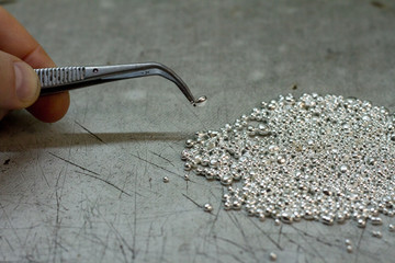 Closeup of a drop of silver for the manufacture of handmade jewelry