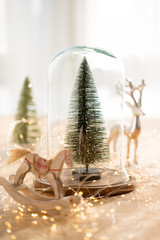 Christmas greeting card. Christmas tree branch on glitter golden bokeh lights background. New Year concept. Copy space.