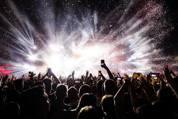 Foto op Aluminium Confetti fireworks above the crowd on music festival. © Drazen