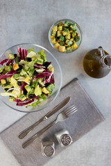 Salad of mix leaves with croutons and olive oil in glass bowl. Concept vngetarianism.