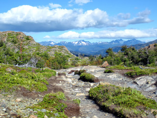 Obraz premium Panoramic view of snowy peaks Andes and famous walking trek in wild Torres del Paine national park, Patagonia, Chile, on a sunny autumn day .