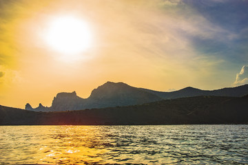 Cape on the sea at sunset